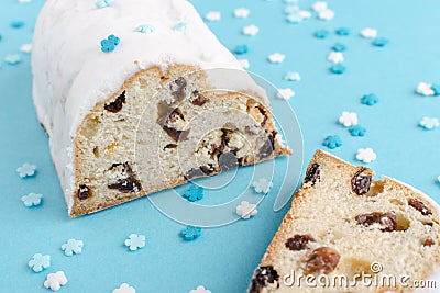 Traditional german christmas cake stollen on blue background Stock Photo
