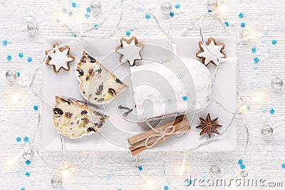 Traditional german christmas cake stollen with cookies and decoration Stock Photo