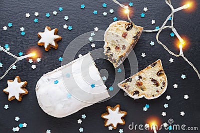 Traditional german christmas cake stollen with cookies and decoration Stock Photo