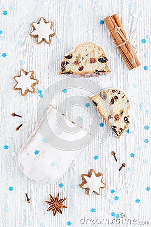 Traditional german christmas cake stollen with cookies and decoration Stock Photo