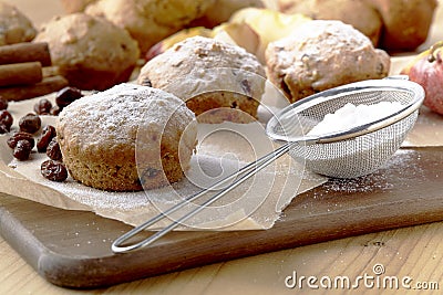 Traditional German Christmas pastry mini stollen on parchment paper on plank wood table Stock Photo