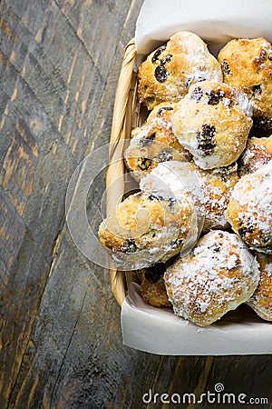 Traditional German Christmas pastry mini stollen in wicker basket on plank wood table. Rustic vintage style Stock Photo