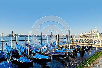 Traditional Gondolas moored by Saint Mark square Editorial Stock Photo