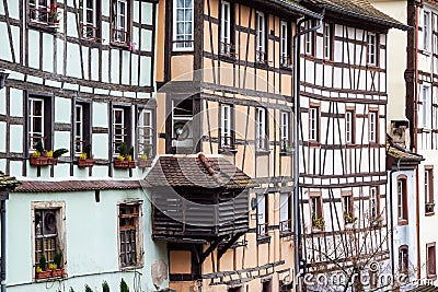 Traditional half-timbered houses on picturesque canals in La Petite France in the medieval fairytale town of Strasbourg Stock Photo