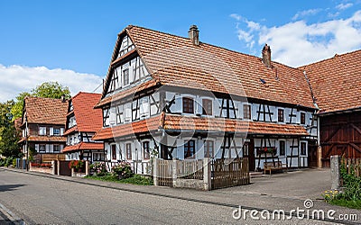Traditional half-timbered houses in the streets of Hunspach in Alsace, France Stock Photo