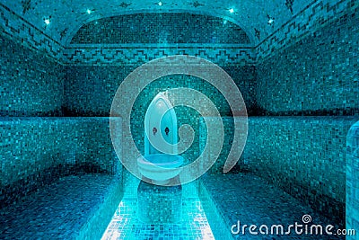 Traditional hammam sauna with modern colored lighting and stone washbasin Stock Photo