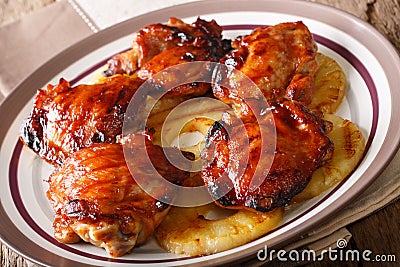 Traditional Hawaiian grilled huli huli chicken with pineapple cl Stock Photo