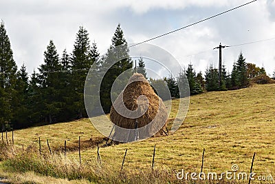 Traditional pile of hay in Romania. Stock Photo