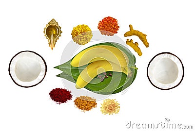 Traditional hindu pooja essential items, bannana, betel leaf, betel nuts, coconut, turmeric, kumkum, turmeric sticks, mari gold fl Stock Photo