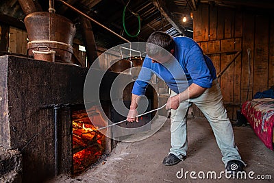 Traditional home made brandy distillery in country side of Romania, Horinca making in Maramures County Editorial Stock Photo