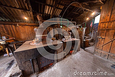 Traditional home made brandy distillery in country side of Romania, Horinca making in Maramures County Editorial Stock Photo