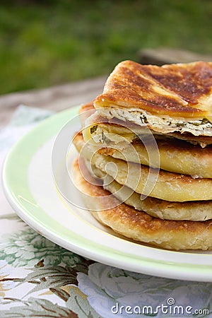 Traditional homemade Romanian and Moldovan pies - Placinta. Rustic style, selective focus. Stock Photo