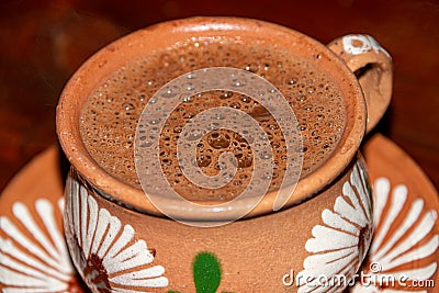 Traditional hot chocolate in a clay mug Stock Photo