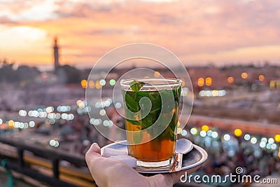 Moroccan mint tea at sunset on a rooftop cafe in Marrakech Stock Photo