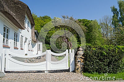 Traditional House with Straw Thatched Roof in Denmark Stock Photo