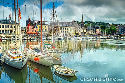 Traditional houses and boats in the old harbor, Honfleur, France Stock Photo