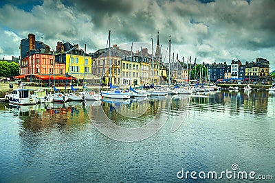 Traditional houses and boats in the old harbor, Honfleur, France Editorial Stock Photo