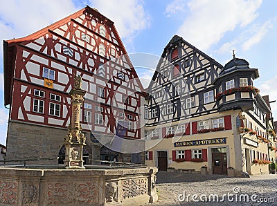 Traditional houses in Markplatz and fountain on the foreground. Editorial Stock Photo