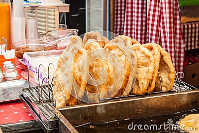 Traditional hungarian fried bread langos sold at a street vendor Stock Photo