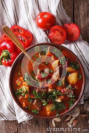 Traditional Hungarian goulash soup bogracs close-up in a bowl. V Stock Photo