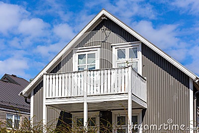 Traditional Icelandic residential ironclad house with gable roof, white window frames, Reykjavik, Iceland Stock Photo