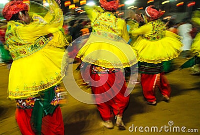 Traditional indian dancers at navratri festival in india at night Editorial Stock Photo