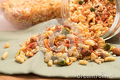 Traditional indian deep fried salty dish - chivda or mixture or farsan in a glass bowl. Stock Photo