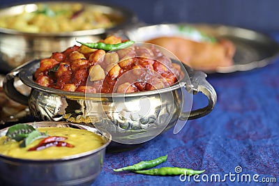 Traditional Indian home-cooked dinner. dishes of national Indian cuisine on a dark blue background. rice, dal, sabji, pakora. top Stock Photo