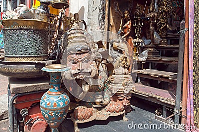 Traditional indian masks in store with vintage furniture, art and antiques Editorial Stock Photo