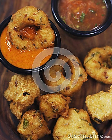 traditional indian snack food, crispy deep fried vada and chutneys close up in a serving plate Stock Photo