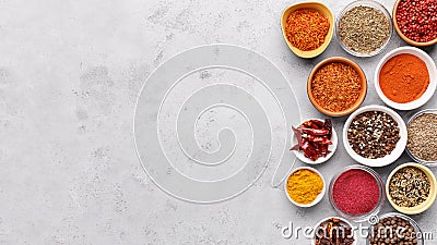 Traditional Indian spices in bowls on grey background Stock Photo