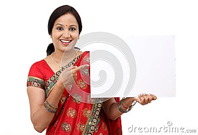 Traditional Indian woman holding a blank billboard Stock Photo