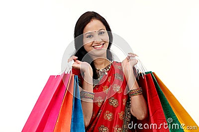 Traditional Indian woman holding shopping bags Stock Photo