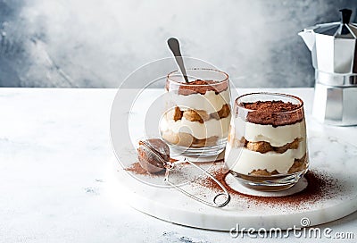 Traditional Italian dessert tiramisu in a glass. Stock Photo