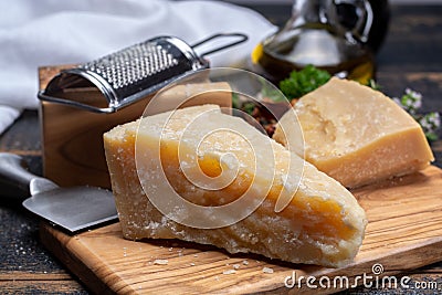 Traditional italian food - 36 months aged in caves Italian parmesan hard cheese from Parmigiano-Reggiano, Italy Stock Photo