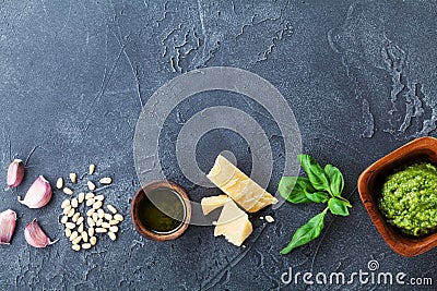 Traditional italian green pesto sauce with fresh ingredients. Healthy and organic food. Empty space for recipe. Stock Photo