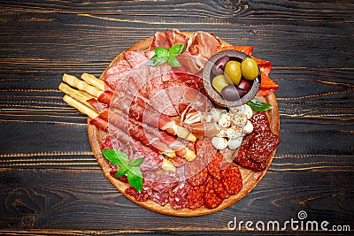 Meat and cheese plate with salami sausage, chorizo, parma and mozzarella Stock Photo