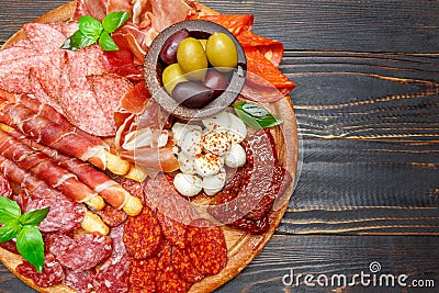 Meat and cheese plate with salami sausage, chorizo, parma and mozzarella Stock Photo