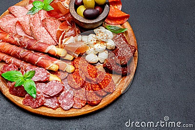 Meat and cheese plate with salami sausage, chorizo, parma and mozzarella Stock Photo