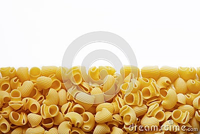 Traditional italian pasta snails or horns on white background Stock Photo