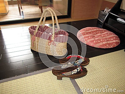 Traditional Japanese accessories including bag, clog shoes and pillow, at the countryside inn hotel Stock Photo