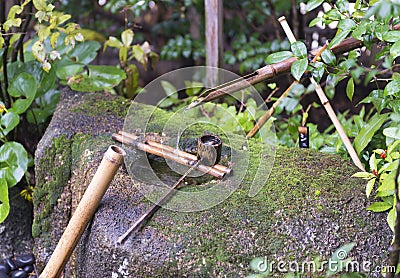 Traditional japanese fountain tsukubai Stock Photo