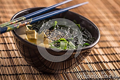 Traditional japanese soup Miso with tofu seaweed chopsticks and Stock Photo