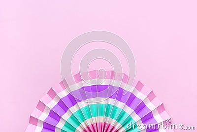 Traditional Japaneses festival paper fan with pink, turquoise, white stripes Birthday party, celebration holidays concept Abstract Stock Photo