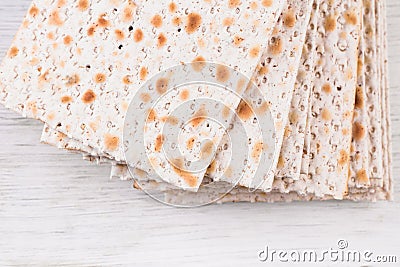 Traditional Jewish kosher matzo for Easter pesah on a wooden table. Stock Photo