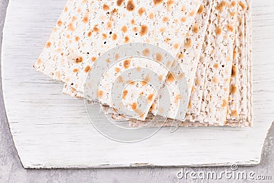 Traditional Jewish kosher matzo for Easter pesah on a wooden table. Stock Photo