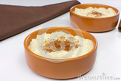 Traditional June party Brazilian dessert made of rice and condensed milk called arroz doce in white background Stock Photo