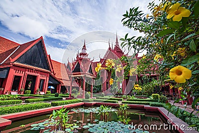 Traditional Khmer architecture and beautiful courtyard of the National Museum of Cambodia, lush pond with lotus, colorful flowers Stock Photo