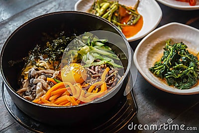 Traditional Korean Dish Bibimbap Served Along With Small Side Dishes Clled Banchan. Asian Authentic Cuisine Stock Photo