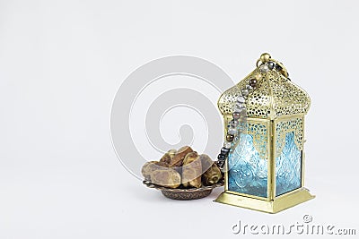 Traditional Lantern and luxury rosary pendent on it with Dates fruits Stock Photo